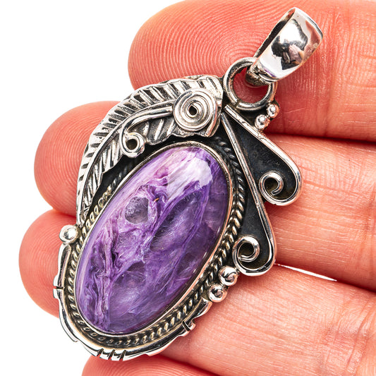 Charoite oval cabochon pendant in .925 sterling silver with ornate bezel and bail