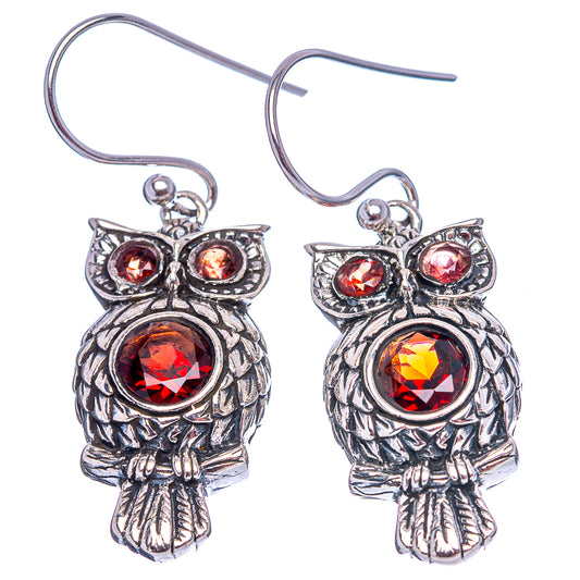 Sterling silver owl dangle earrings with red gemstone accents and fishhook ear wires