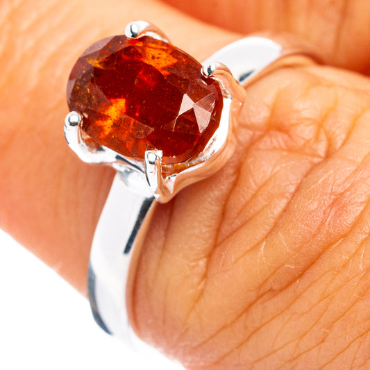 Orange kyanite sterling silver ring with four-prong round gemstone setting