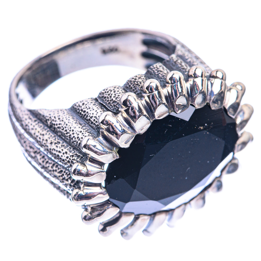 Black onyx ring with faceted oval center stone and silver-tone prong halo, textured band