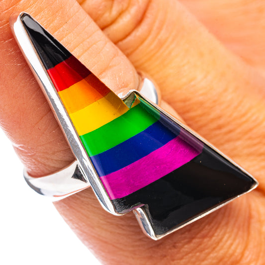 Sterling silver ring with rainbow-striped and black bolt-shaped centerpiece, open shank