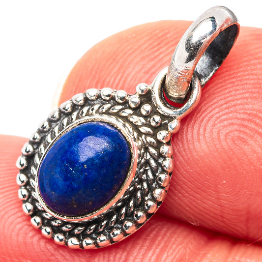 Sterling silver lapis lazuli pendant with oval blue cabochon and ornate beaded bezel