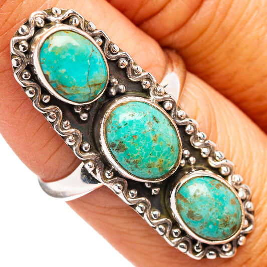 Turquoise three-stone oval ring with ornate silver bezel setting