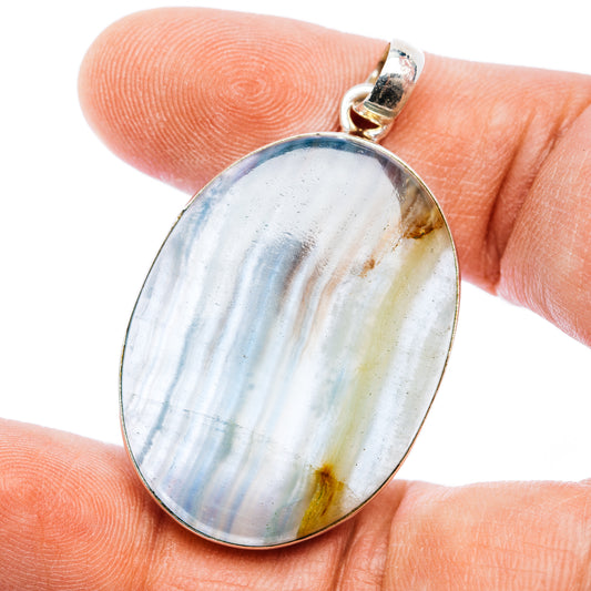 Oval blue-and-white calcite pendant with .925 sterling silver bezel and bail
