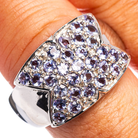 Sterling silver ring with purple oval gemstone and clear stone cluster design
