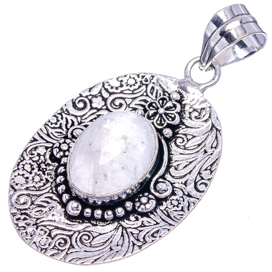 German silver oval moonstone pendant with engraved floral border and oval cabochon