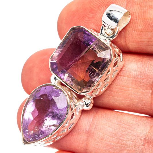 Sterling silver amethyst pendant with faceted purple stones and ornate frame