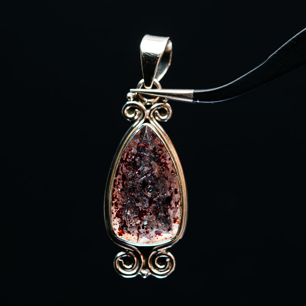 Sterling silver lepidocrocite teardrop pendant with red glitter stone and ornate bail