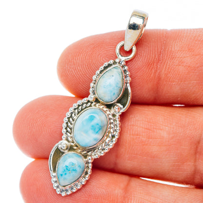 Sterling silver pendant with three oval light-blue stones and textured bezel