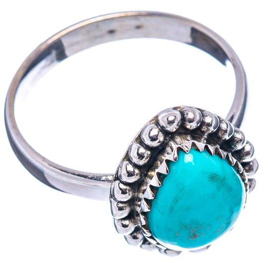 Sterling silver turquoise ring with oval cabochon and bead-like border, side view