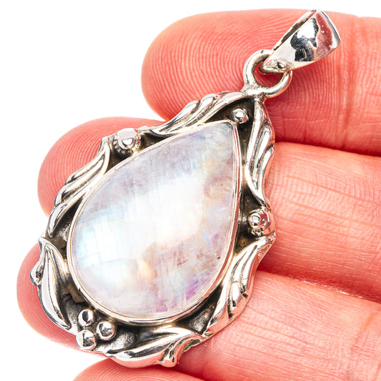 Teardrop moonstone pendant in .925 sterling silver, ornate bezel with round accents.
