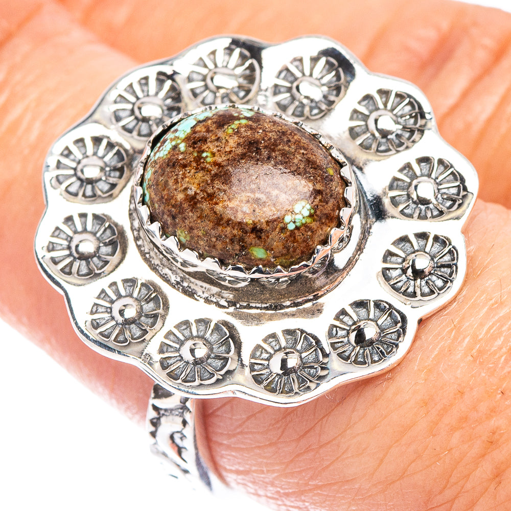 Turquoise cabochon sterling silver ring with ornate floral bezel and scalloped edges