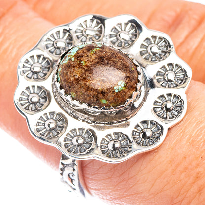 Turquoise cabochon sterling silver ring with ornate floral bezel and scalloped edges