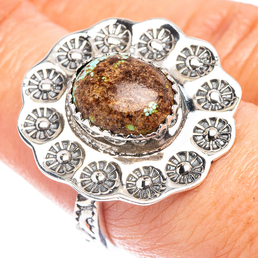 Turquoise cabochon sterling silver ring with ornate floral bezel and scalloped edges