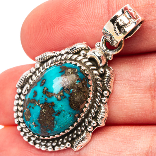 Turquoise oval pendant in .925 sterling silver with ornate rope bezel