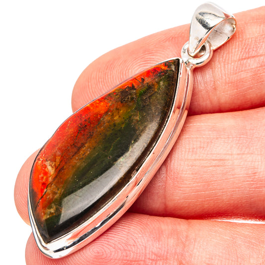 Sterling silver ammolite teardrop pendant with iridescent red, green and gold stone in bezel