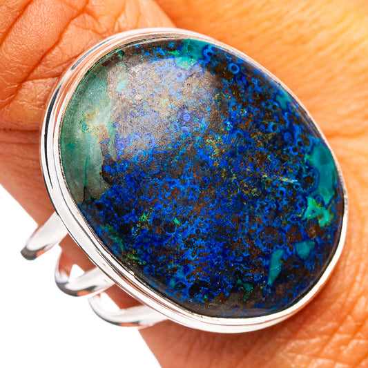Sterling silver oval stone ring with blue-green marbled bezel setting