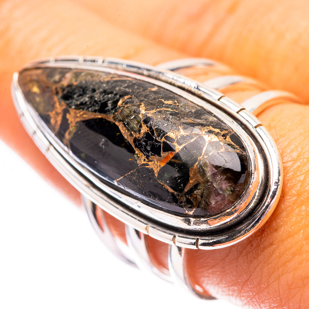 Sterling silver oval ring featuring dark onyx with gold flecks on top