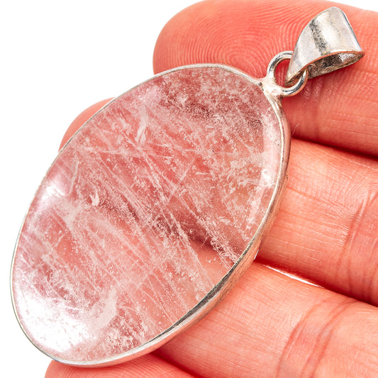 Pink selenite oval pendant with silver-plated bail, 2 1/8 in size