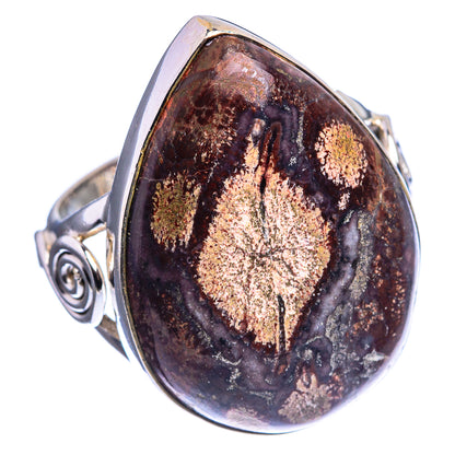 Oval sterling silver ring with dark rhyolite cabochon, gold glitter streaks and swirled band