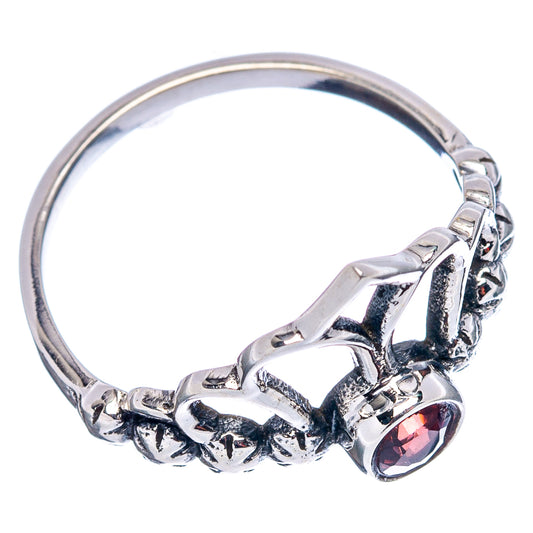 Sterling silver dainty crown ring, side view with round garnet-red gemstone bezel