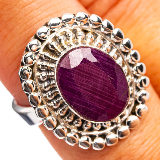 Sterling silver tone ring with round purple ruby cabochon and beaded halo edge