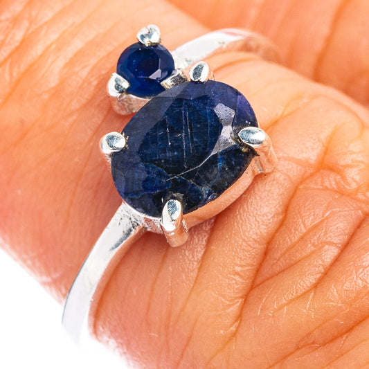 Sterling silver ring with round blue sillimanite gemstone and small prong accents