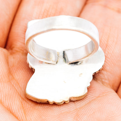 Sterling silver adjustable ring band with open back and hammered texture on inside