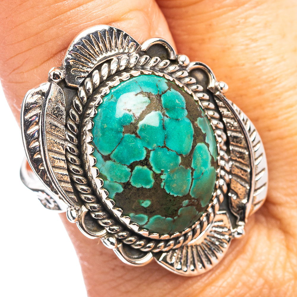 Turquoise oval sterling silver adjustable ring with Southwestern patterned bezel