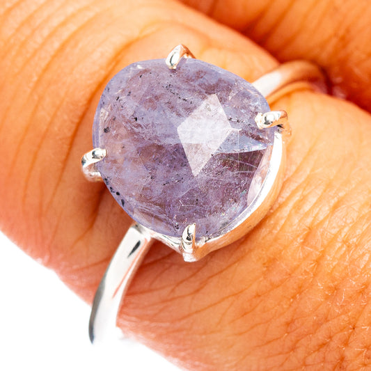 Faceted tanzanite ring with oval purple stone, four-prong setting, .925 sterling band