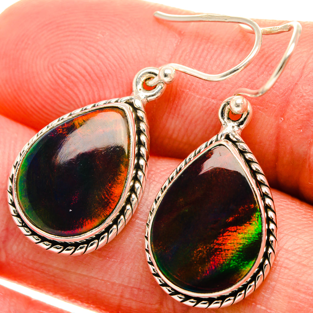 Sterling silver opal teardrop earrings with rainbow iridescent stone and ornate edge