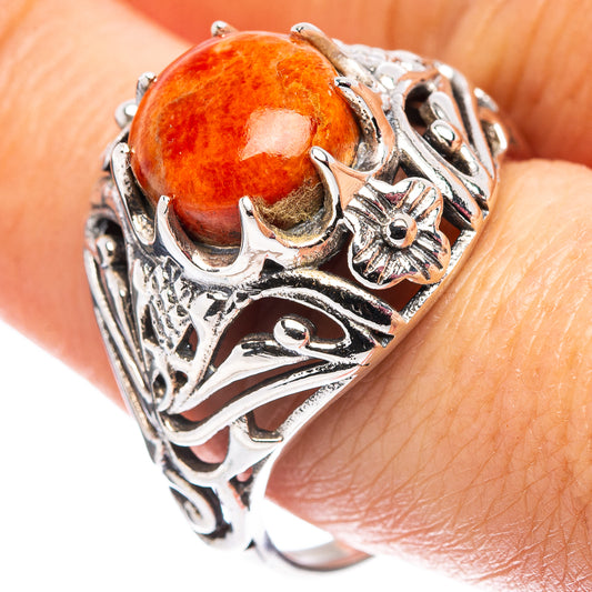 Orange coral cabochon sterling silver filigree ring with cutout floral and scrollwork
