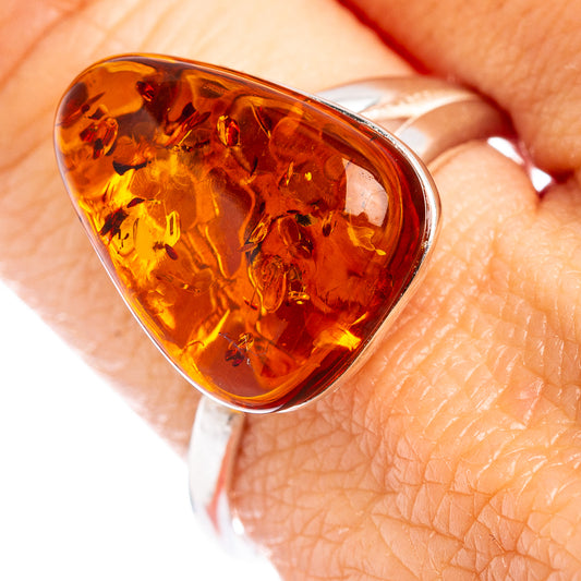 Amber and .925 sterling silver adjustable ring with oval honey-colored stone