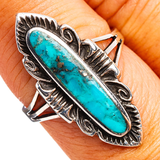 Turquoise oval sterling silver ring, ornate bezel and raised pattern, size 7.75