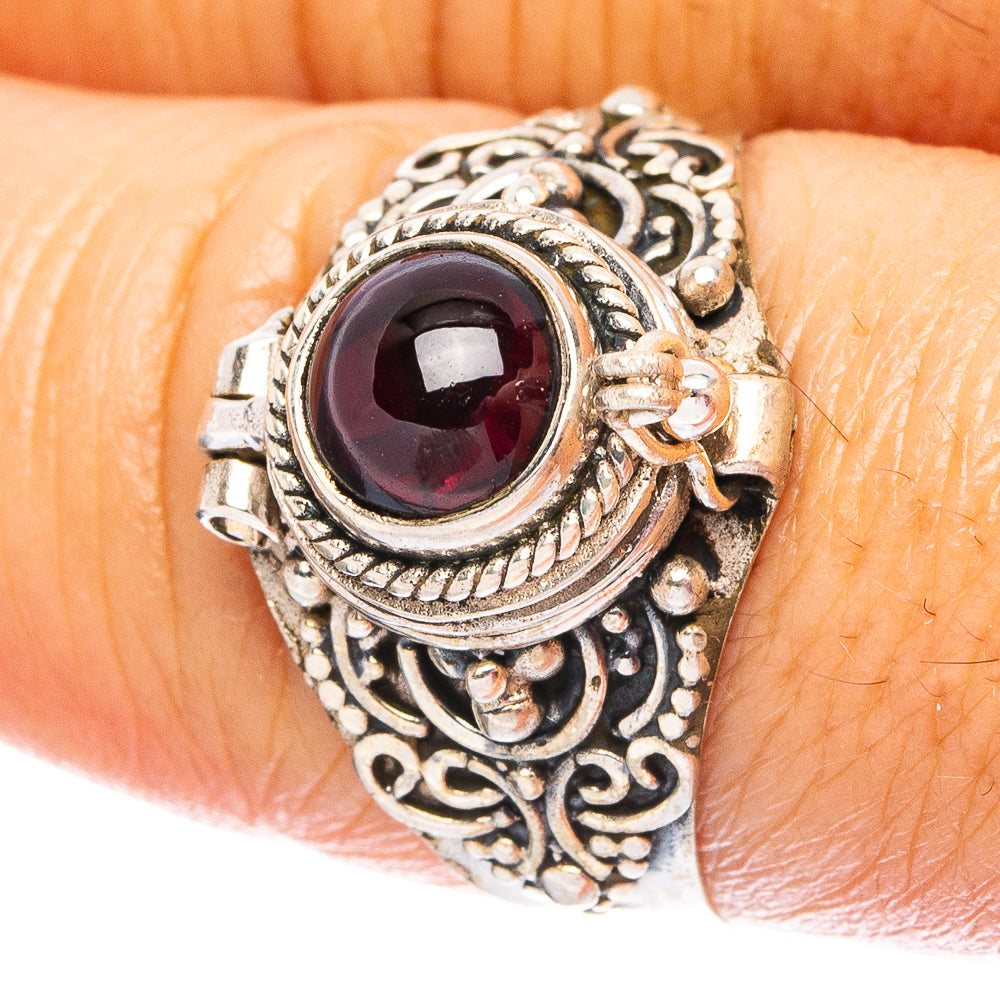 Antique-style sterling silver ring with dark red round gemstone bezel setting