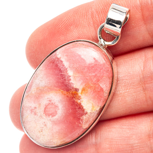 Oval rhodochrosite pendant in .925 sterling silver with round bail, pink stone cabochon