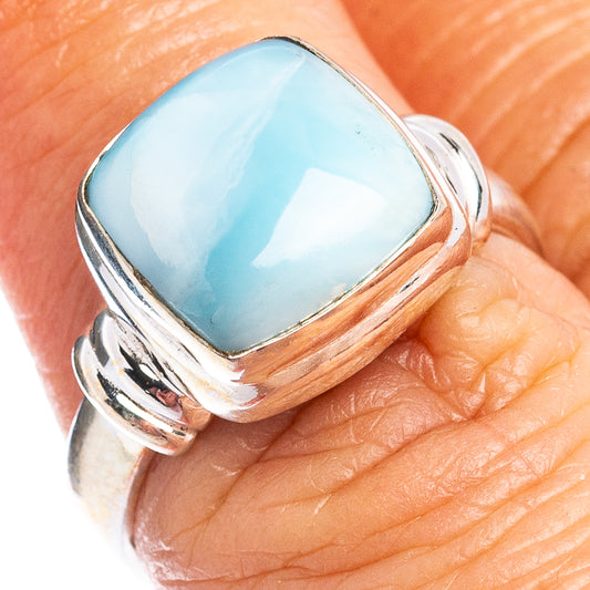 Oval blue larimar cabochon 925 sterling silver ring on finger, polished band
