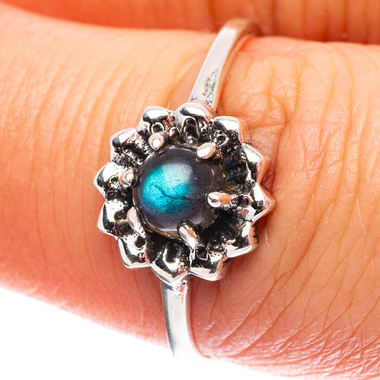 Sterling silver ring with blue labradorite cabochon and ornate scalloped halo