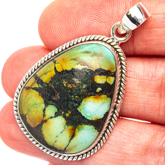 Oval turquoise pendant with .925 sterling silver rope border and loop bail.