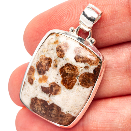 Sterling silver square gemstone pendant with mottled brown crystal center