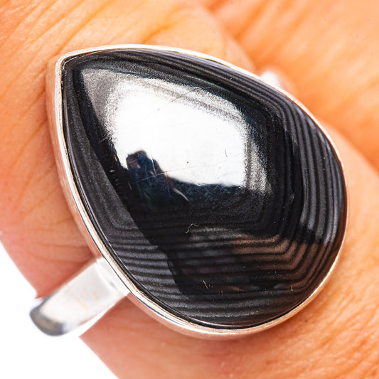 Sterling silver ring with black teardrop cabochon, silver bezel and tapered band