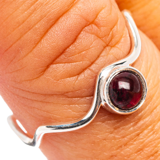 Dainty garnet ring, oval dark red gemstone in .925 sterling silver bezel.