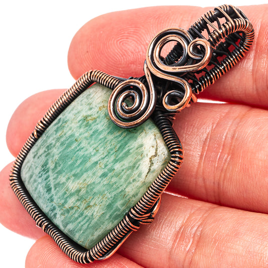 Oxidized copper wire-wrapped amazonite oval pendant with spiral accents