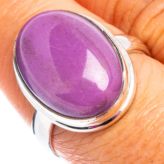 Sterling silver ring with purple oval cabochon gemstone, polished bezel setting