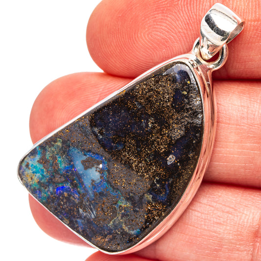 Oval boulder opal pendant in .925 sterling silver bezel, dark blue and gold speckled