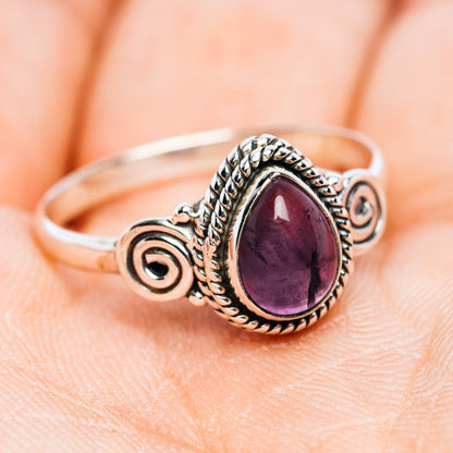 Sterling silver amethyst oval ring with raised halo and spiral side details, size 9.5