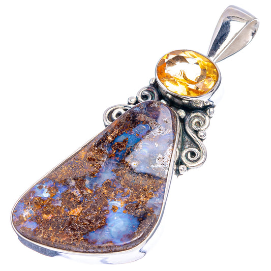 Sterling silver teardrop pendant with boulder opal centerpiece and oval citrine drop