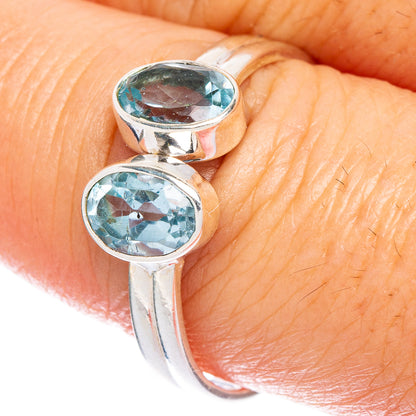 Sterling silver dainty ring with two oval blue topaz stones on the band