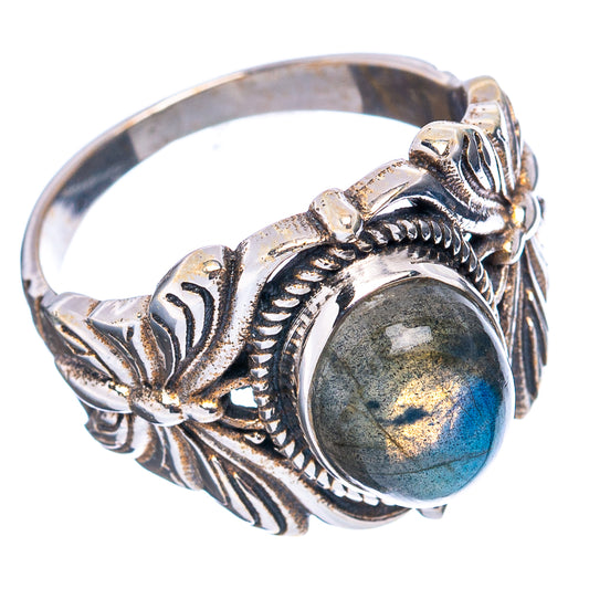 Sterling silver butterfly ring with oval labradorite cabochon, ornate leaf details.