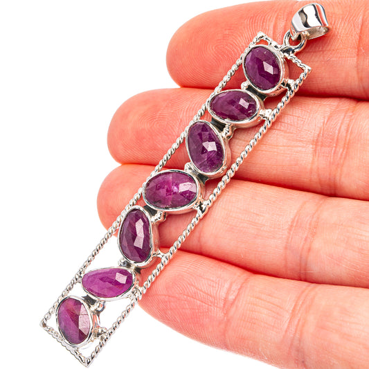 Ruby pendant in .925 sterling silver with oval faceted pink-red stones, hinged bail